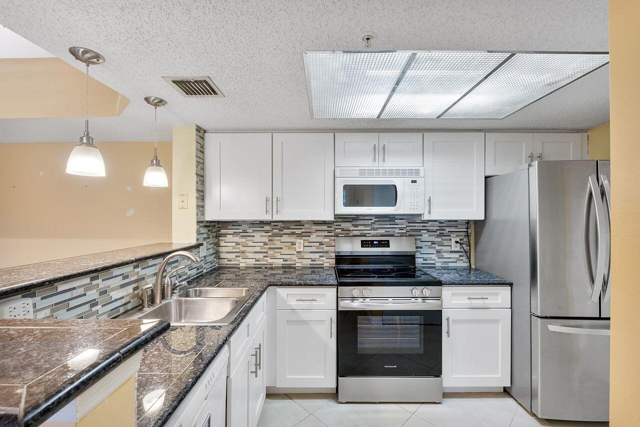 5011 Wiles Road Unit 303 — photo
