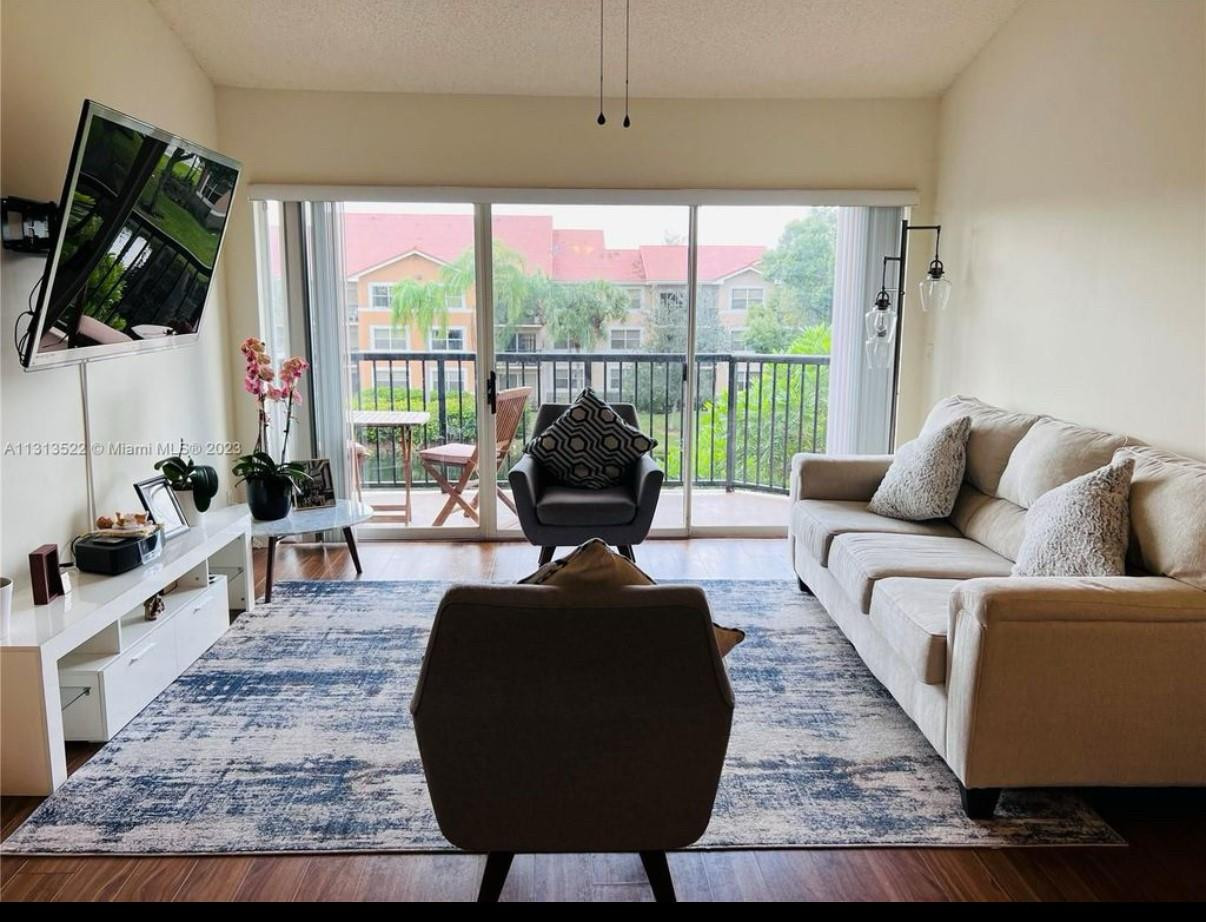 9055 Wiles Road Unit 304 — photo