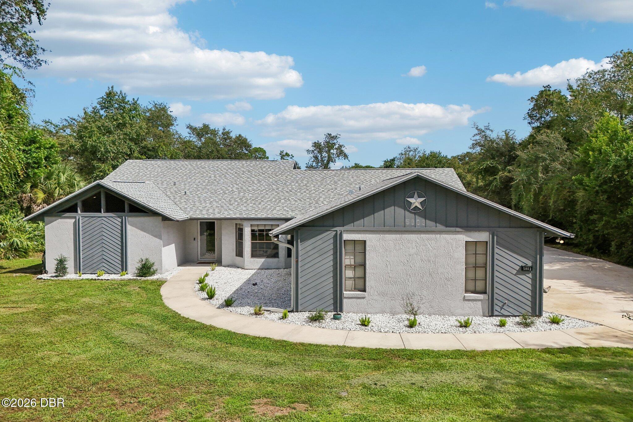 5803 Spruce Creek Woods Drive — photo