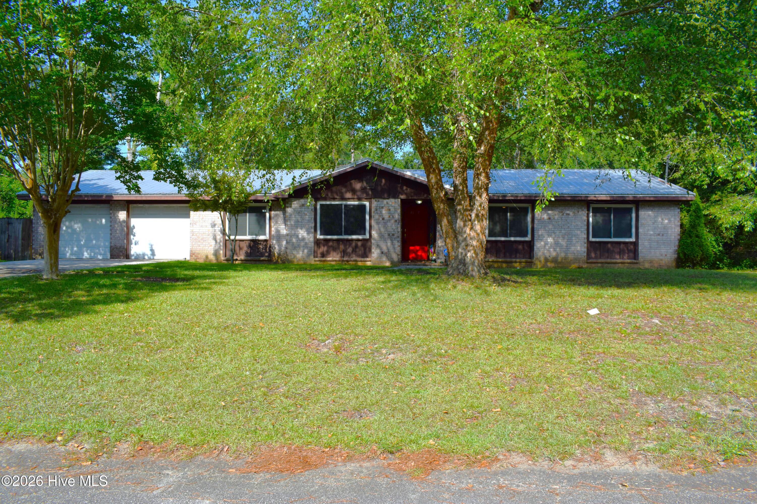 4011 Whispering Pines Road S — photo