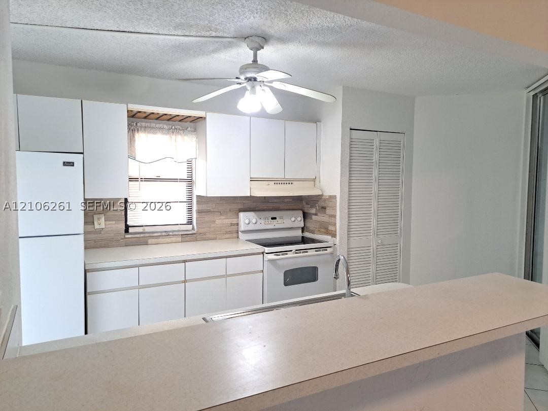 3100 N Pine Island Rd Unit 104 — photo